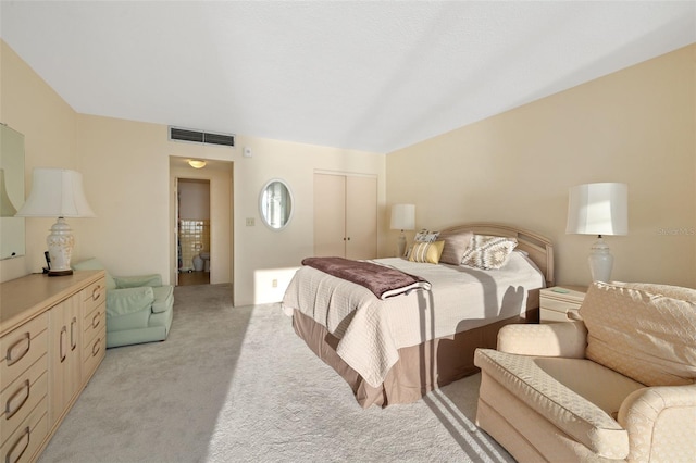 carpeted bedroom featuring a closet