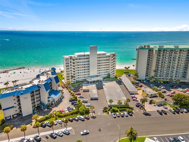 birds eye view of property featuring a water view and a view of the beach