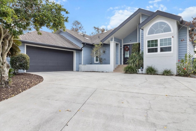 single story home featuring a garage