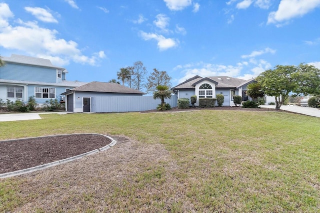 ranch-style home with a front yard