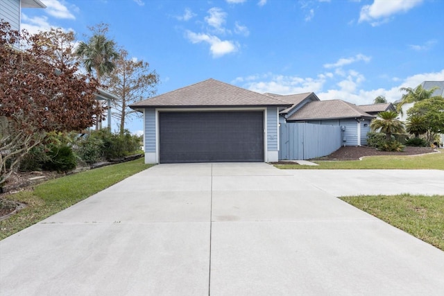 view of front of property with a front yard and a garage