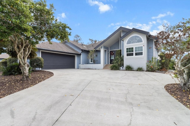 ranch-style home featuring a garage