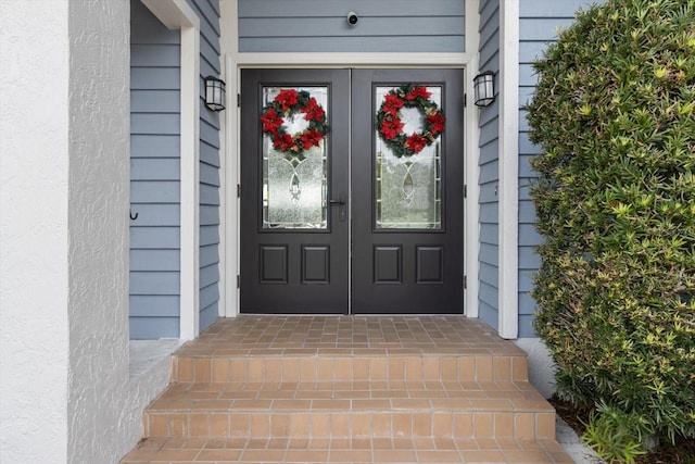 entrance to property featuring french doors