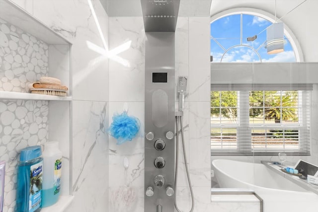 bathroom with tile walls and independent shower and bath