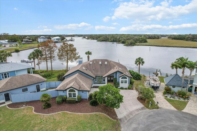 birds eye view of property with a water view