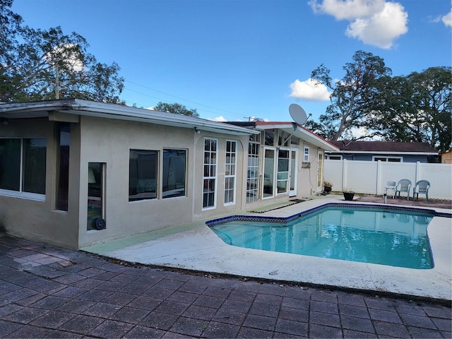 view of swimming pool with a patio area