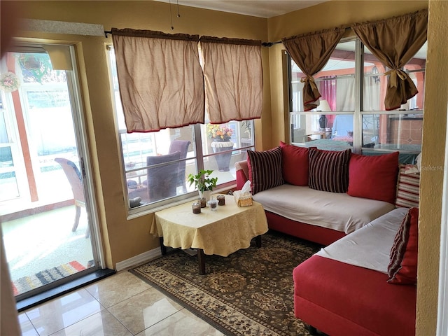 living room with tile patterned flooring and a wealth of natural light