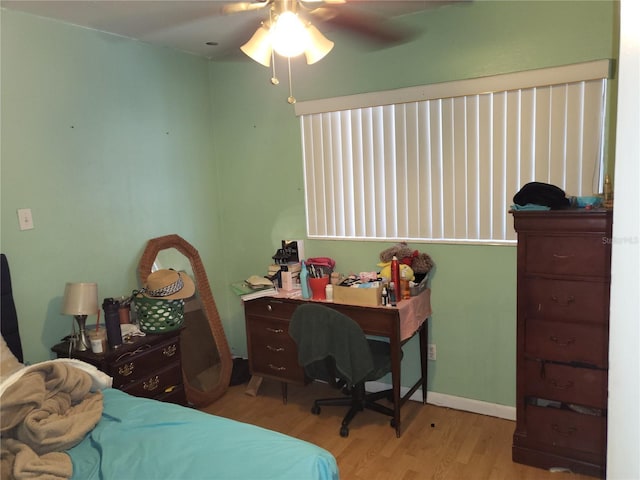 bedroom featuring light wood-type flooring and ceiling fan