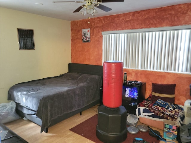 bedroom featuring wood-type flooring and ceiling fan