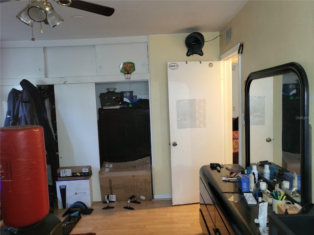 interior space with ceiling fan and light hardwood / wood-style flooring