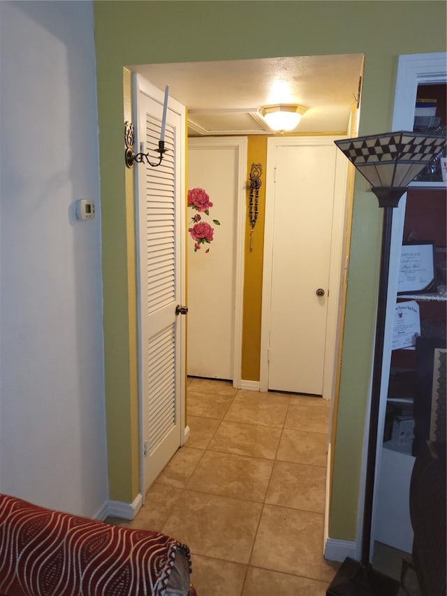 hallway featuring light tile patterned floors