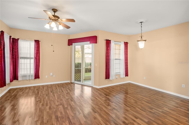 spare room featuring ceiling fan and wood-type flooring