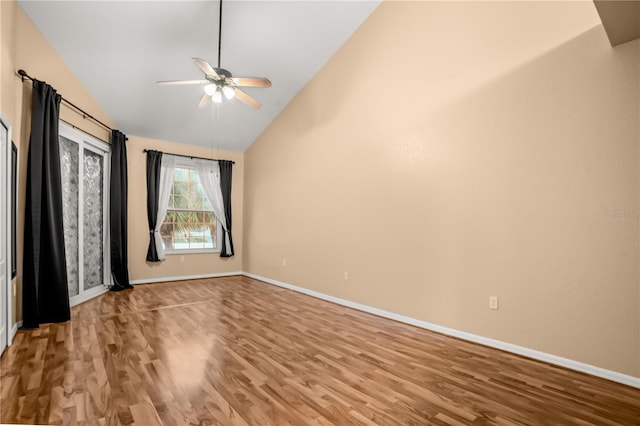 unfurnished bedroom featuring ceiling fan, hardwood / wood-style floors, and high vaulted ceiling