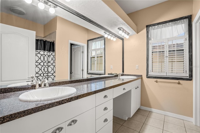 bathroom featuring tile patterned floors and vanity