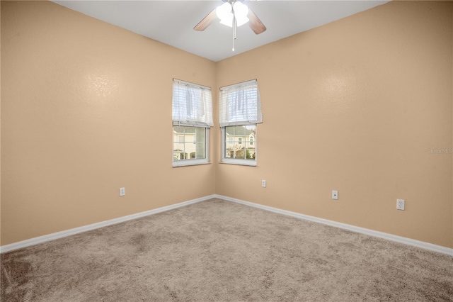 carpeted empty room with ceiling fan