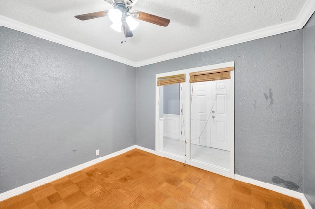 unfurnished bedroom featuring a textured ceiling, ceiling fan, parquet flooring, and crown molding