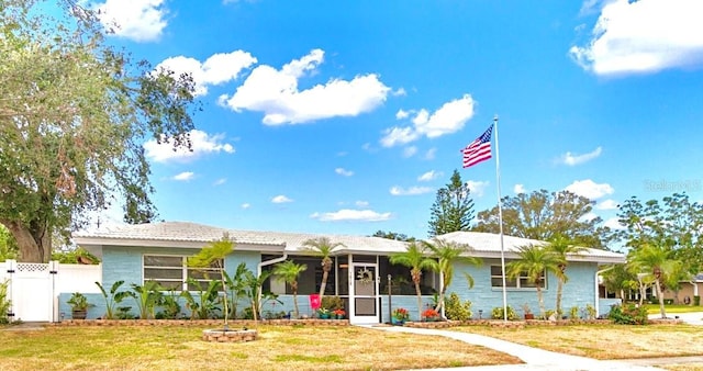 ranch-style home featuring a front yard