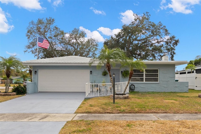 single story home featuring a front yard and a garage