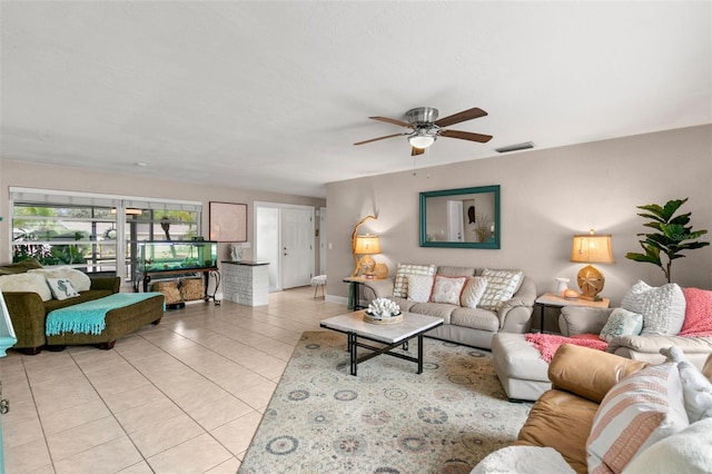 living room with ceiling fan and light tile patterned floors