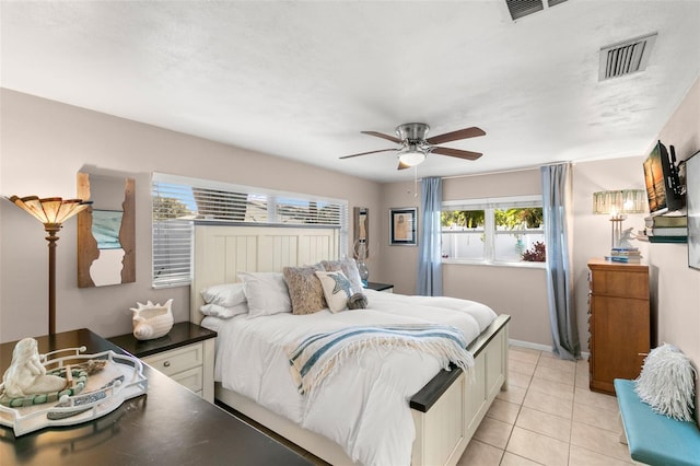 bedroom featuring ceiling fan and light tile patterned flooring