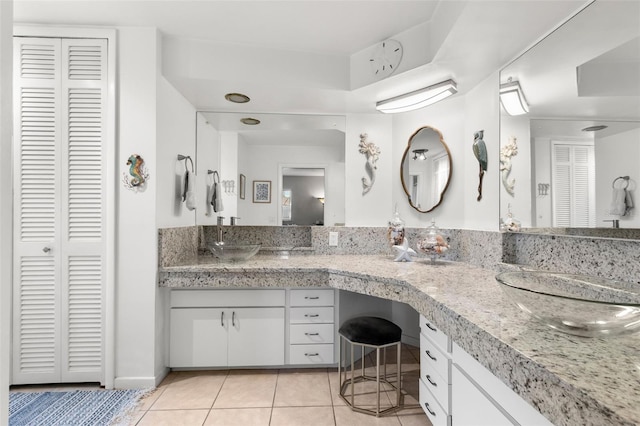 bathroom with tile patterned flooring and vanity