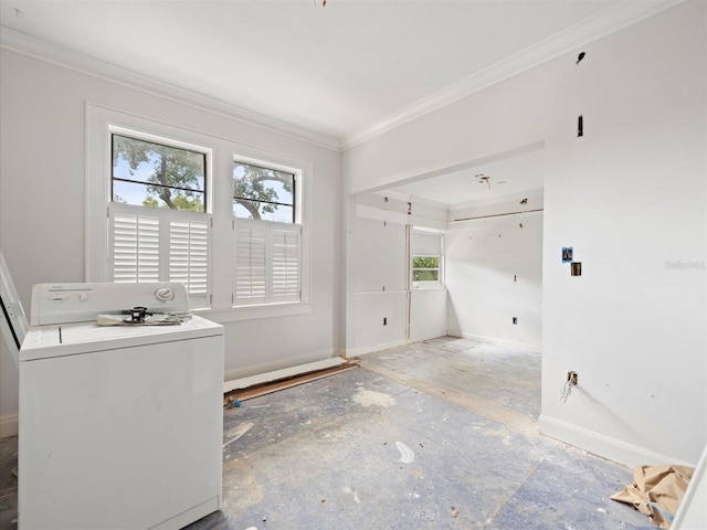 laundry room with ornamental molding and washer / dryer