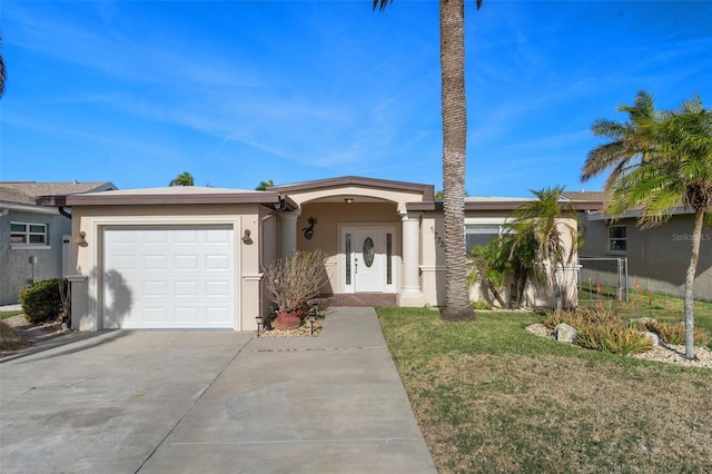 ranch-style house featuring a garage and a front lawn