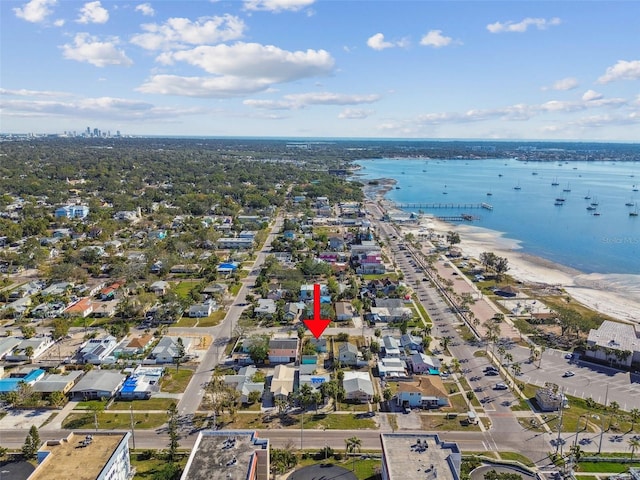 birds eye view of property with a water view and a view of the beach