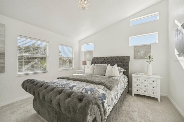 bedroom featuring lofted ceiling and light carpet