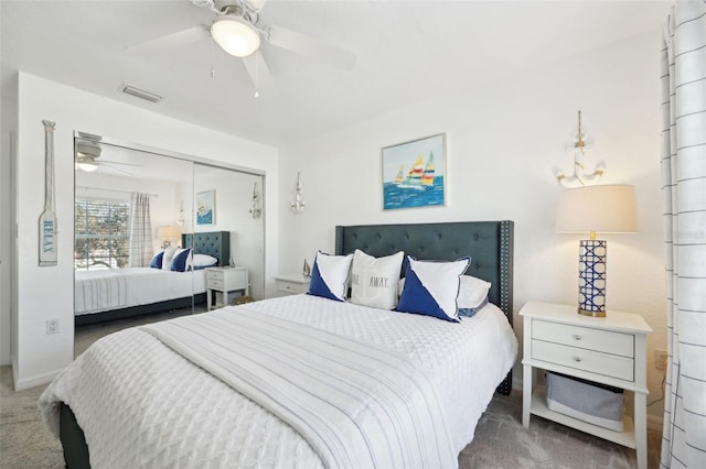 bedroom featuring ceiling fan, a closet, and carpet