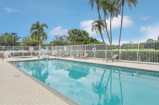 view of swimming pool with a patio area