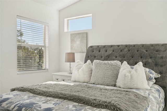 bedroom featuring lofted ceiling