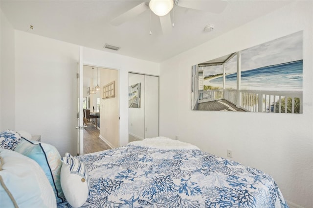 bedroom featuring a closet, ceiling fan, and hardwood / wood-style flooring