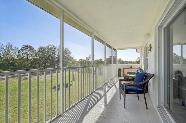 sunroom / solarium featuring a healthy amount of sunlight