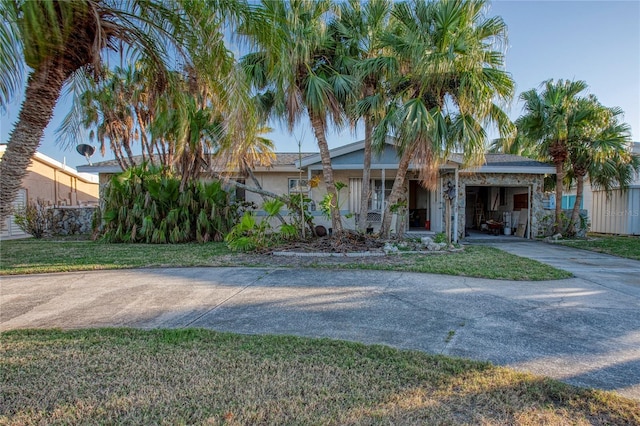 view of front of house with a front yard and a garage