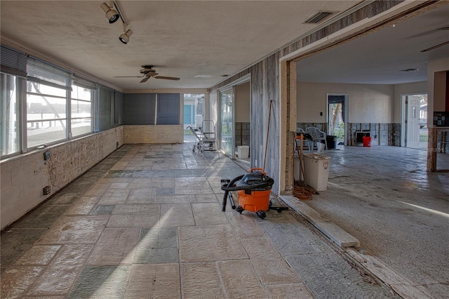 hallway featuring rail lighting