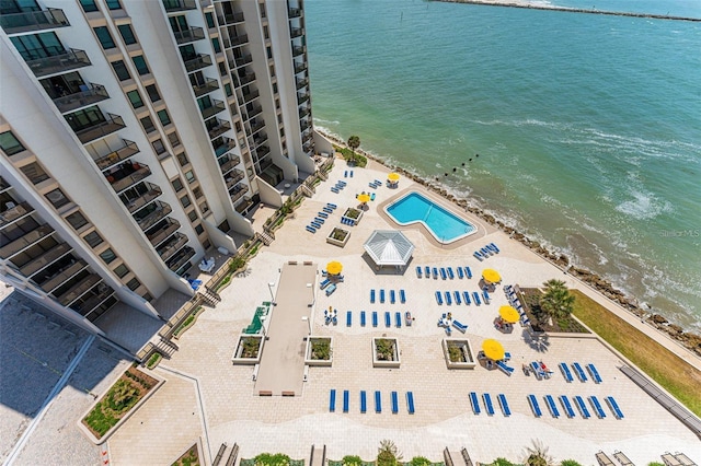 bird's eye view with a water view and a beach view