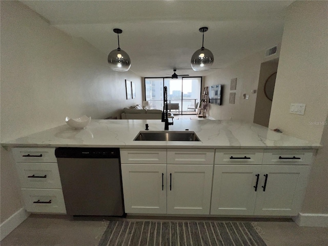 kitchen featuring kitchen peninsula, light stone countertops, sink, dishwasher, and white cabinetry