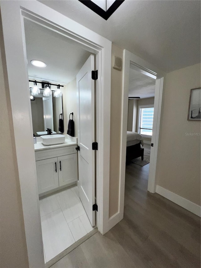 bathroom featuring vanity and hardwood / wood-style flooring