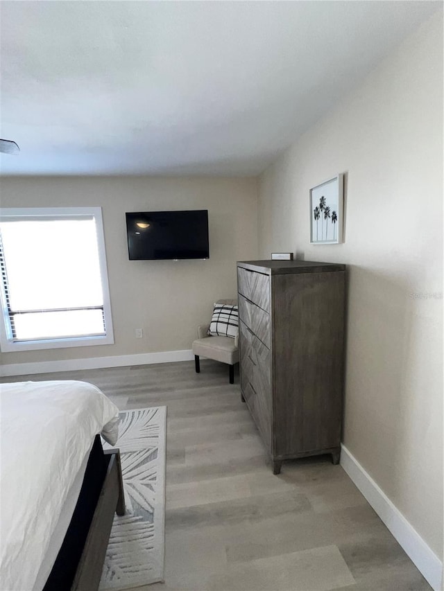 bedroom with light hardwood / wood-style flooring