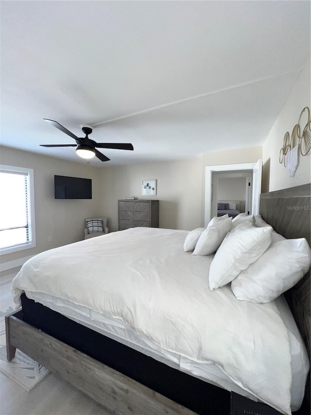 bedroom featuring ceiling fan and wood-type flooring