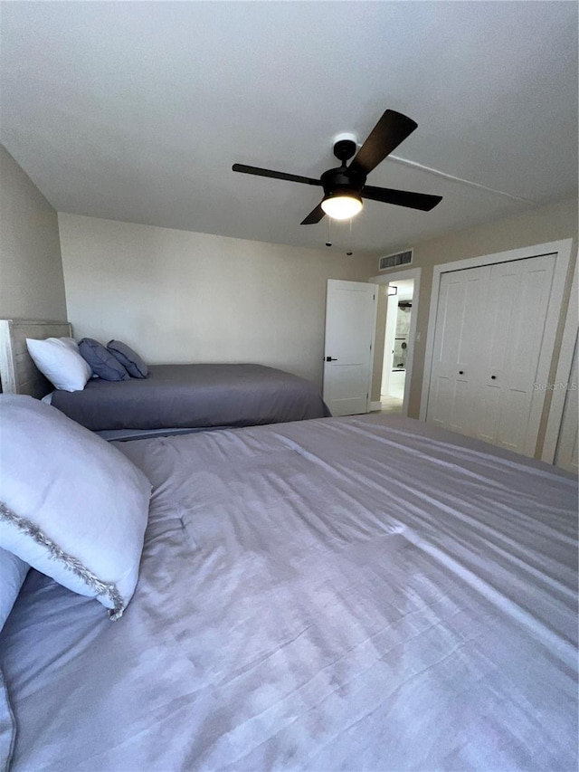 unfurnished bedroom with carpet, a closet, and ceiling fan