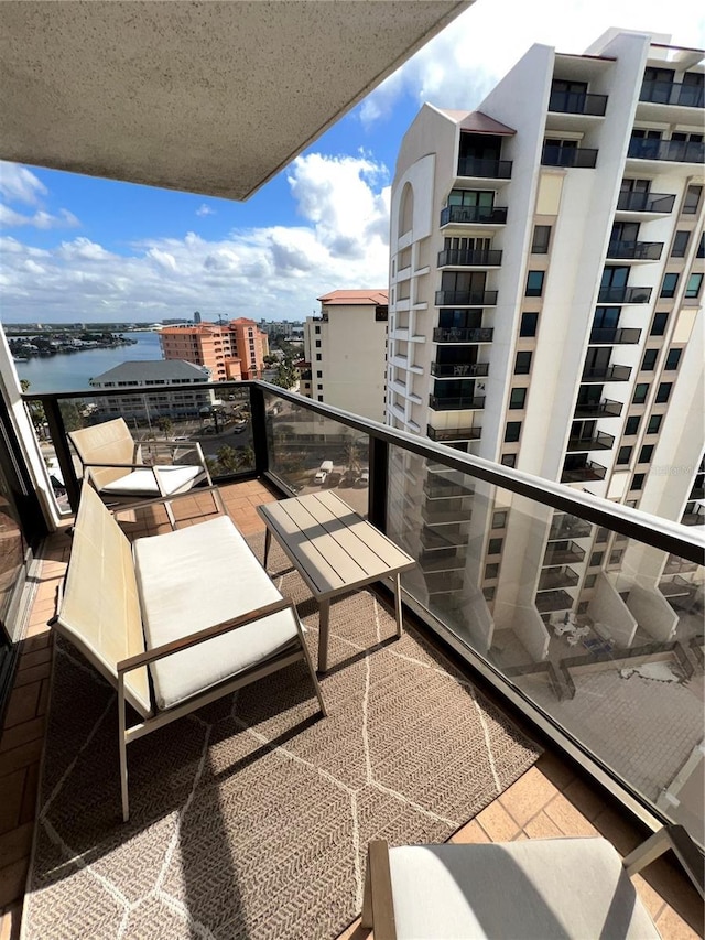 balcony featuring a water view