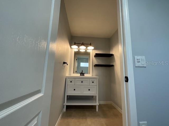 bathroom featuring vanity and baseboards