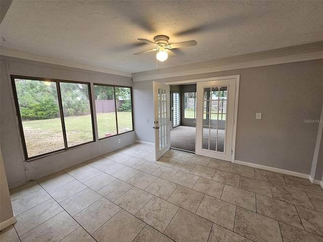 interior space featuring french doors, a textured ceiling, and ceiling fan