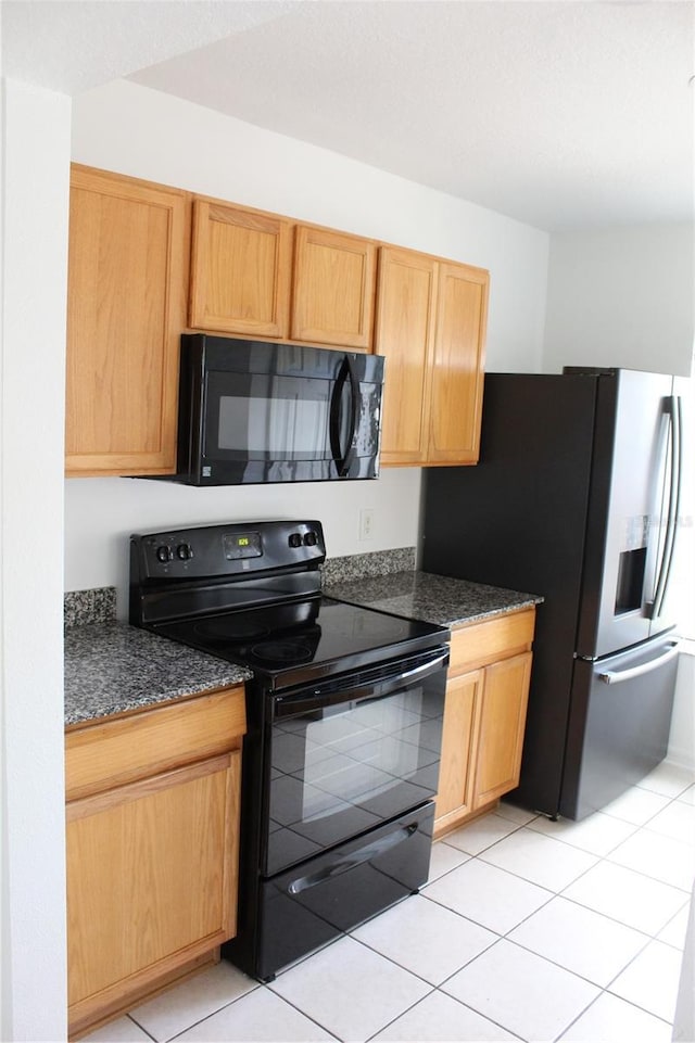 kitchen featuring black appliances and light tile patterned floors