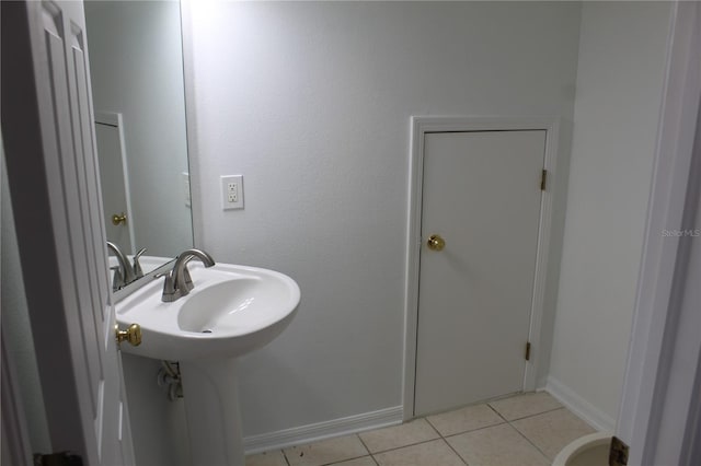 bathroom featuring tile patterned flooring and sink