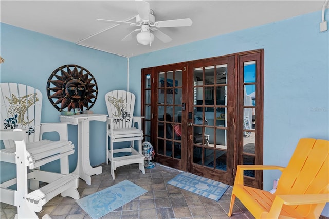 interior space featuring ceiling fan and french doors