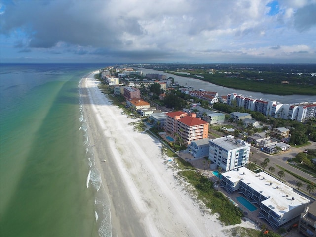 bird's eye view with a water view and a view of the beach