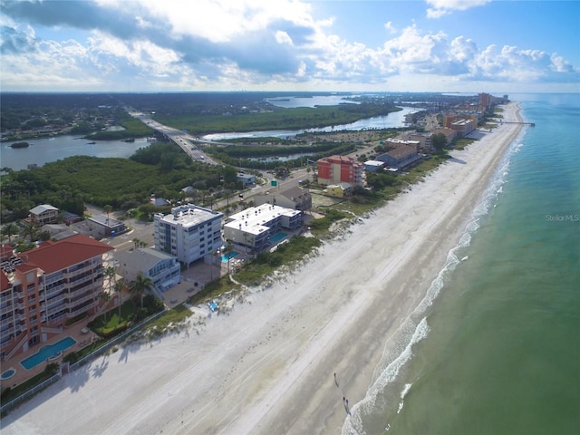 birds eye view of property featuring a view of the beach and a water view